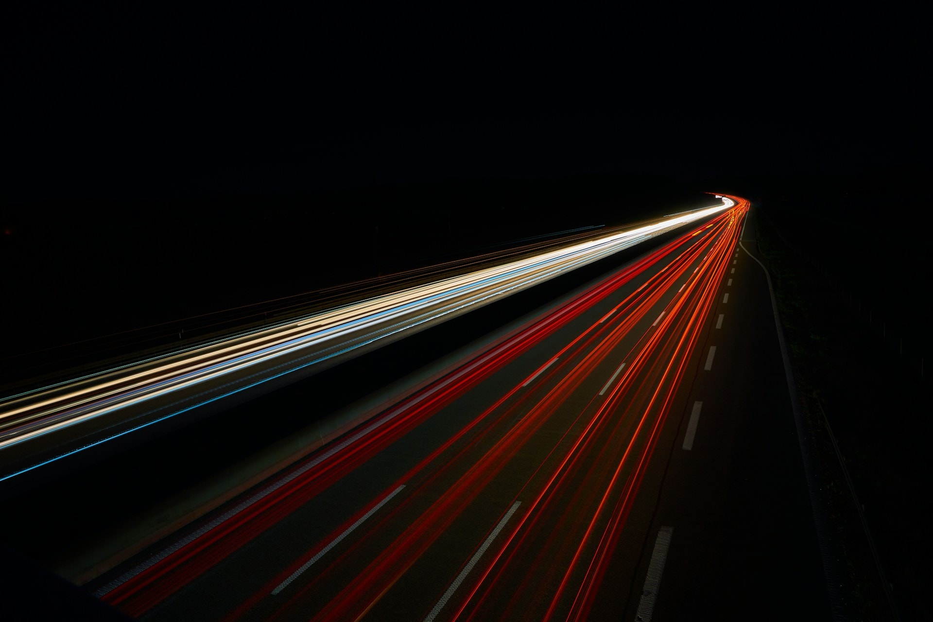 Long exposure highway light trails at night representing creative adaptation and campaign rollout across multiple markets by DIGI MEDIA